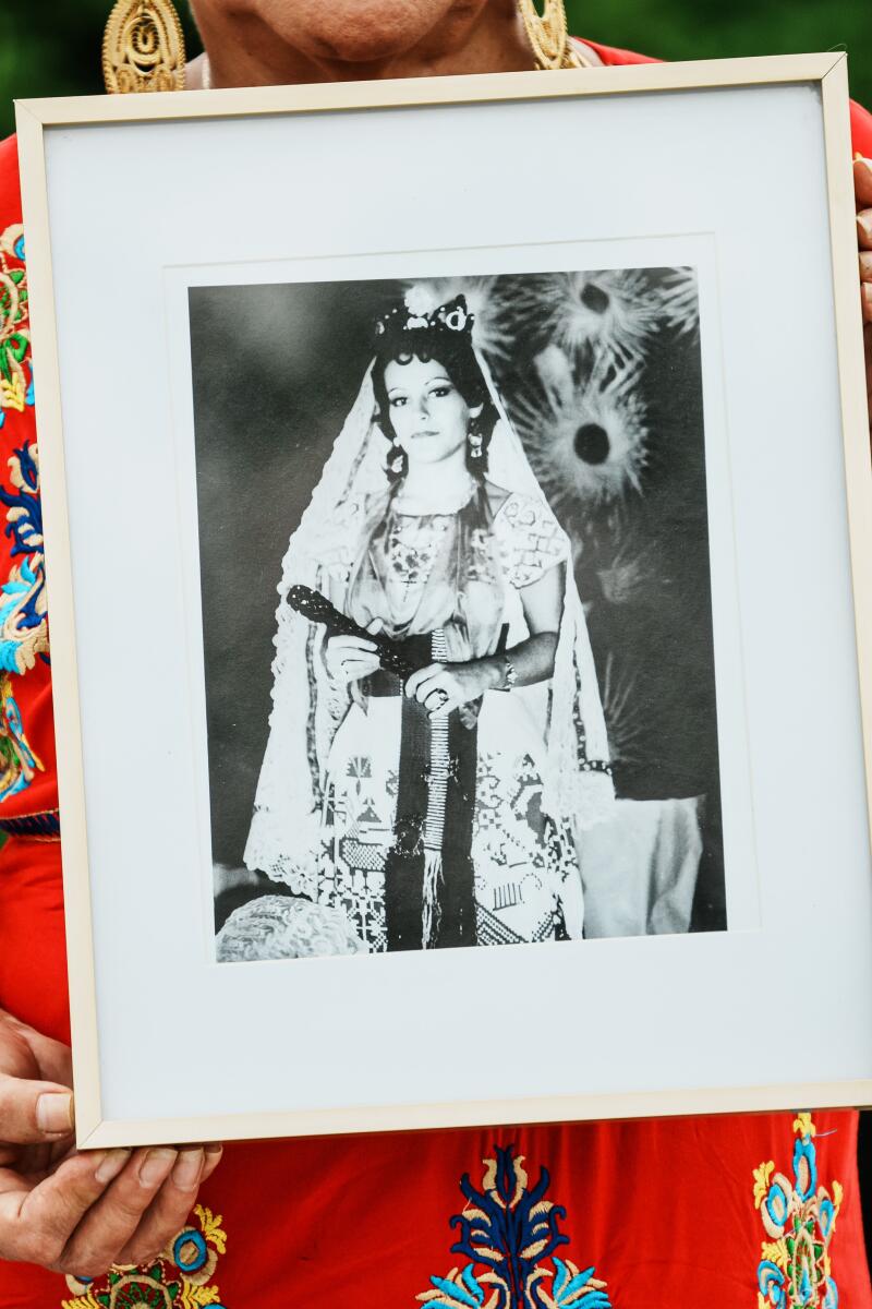 Josefa Vargas Riaño holds a framed photo of her as queen in 1972. 