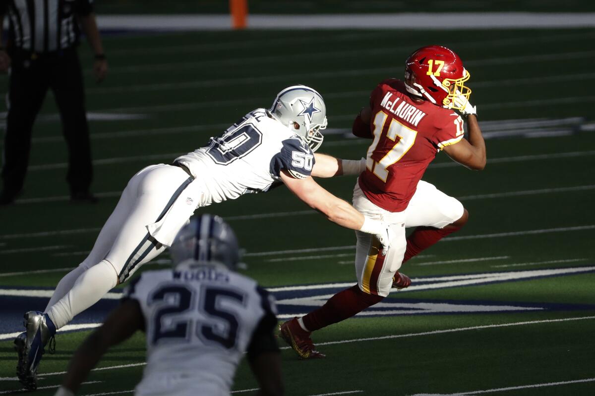 Dallas Cowboys linebacker Sean Lee (50) dives in an attempt to tackle Washington Football Team wide receiver Terry McLaurin (17) during the first half of an NFL football game in Arlington, Texas, Thursday, Nov. 26, 2020. The ever-improving route-running, the key catches and the scores are what Washington pays Terry McLaurin for on game days -- and the sorts of things that get plenty of attention around the NFL and from fans.(AP Photo/Roger Steinman)