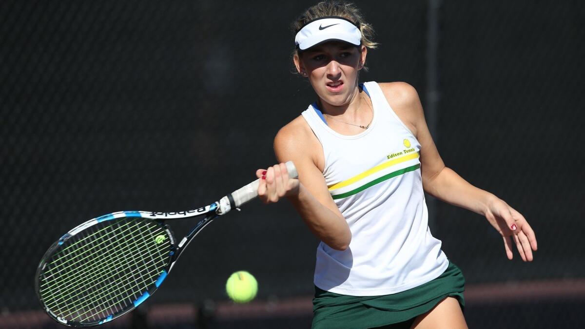 Edison High singles player Zoe Coggins hits a forehand against Laguna Beach in Wave League play on Oct. 9.