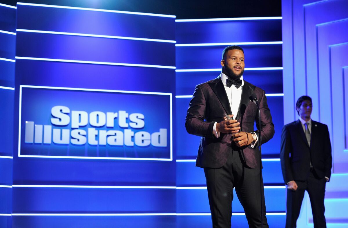 Rams defensive tackle Aaron Donald accepts the "Performer of the Year" award during the Sports Illustrated 2018 Sportsperson of the Year Awards Show on Dec. 11, 2018.
