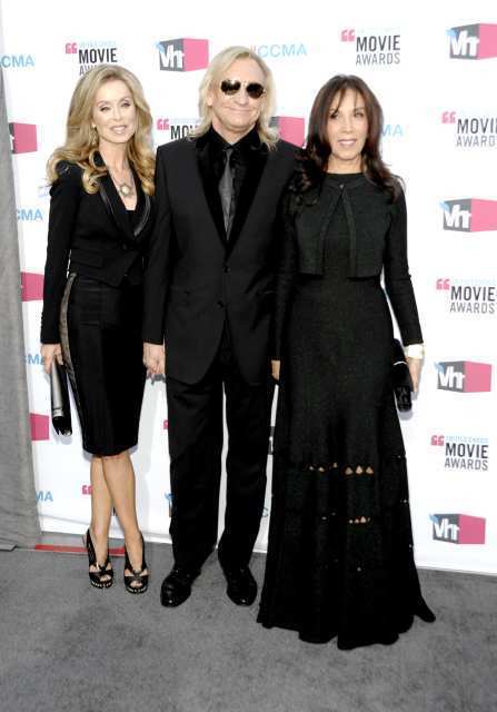 Olivia Harrison, right, looks chic and comfortable in what I suspect is Azzedine Alaia. At center, Joe Walsh and Marjorie Bach, left.