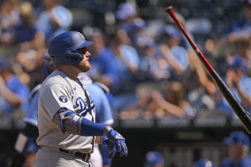Los Angeles Dodgers' Max Muncy throws his bat after striking out during the eighth inning.