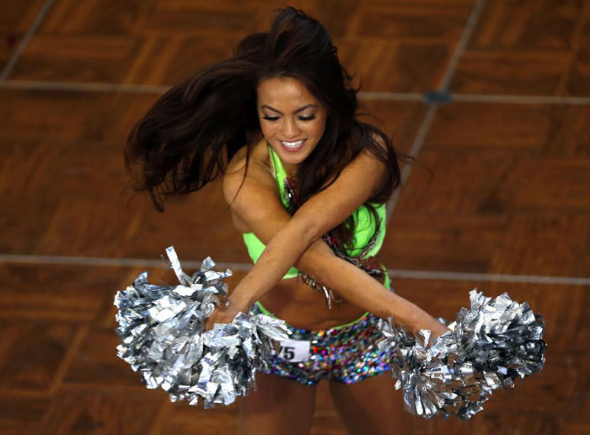 Notre Dame cheerleading squad and mascot practicing before