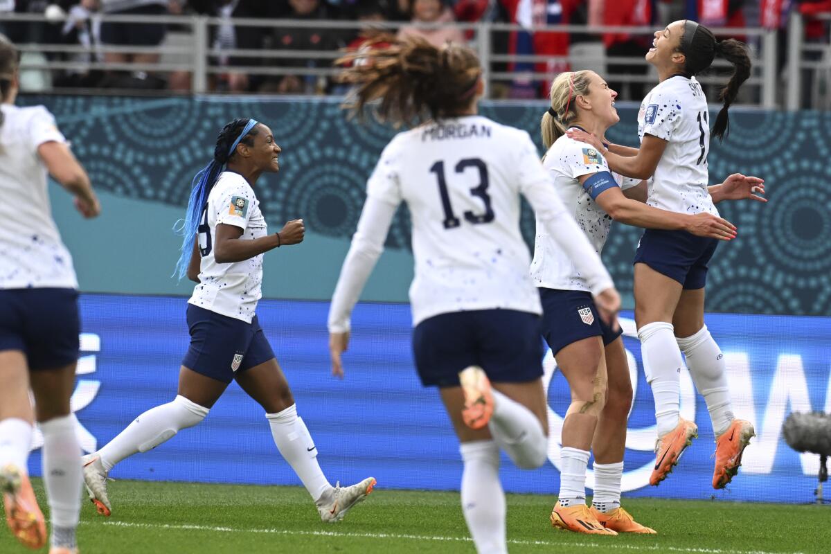 Sophia Smith, right, celebrates with her U.S. teammates after scoring in the first half against Vietnam.