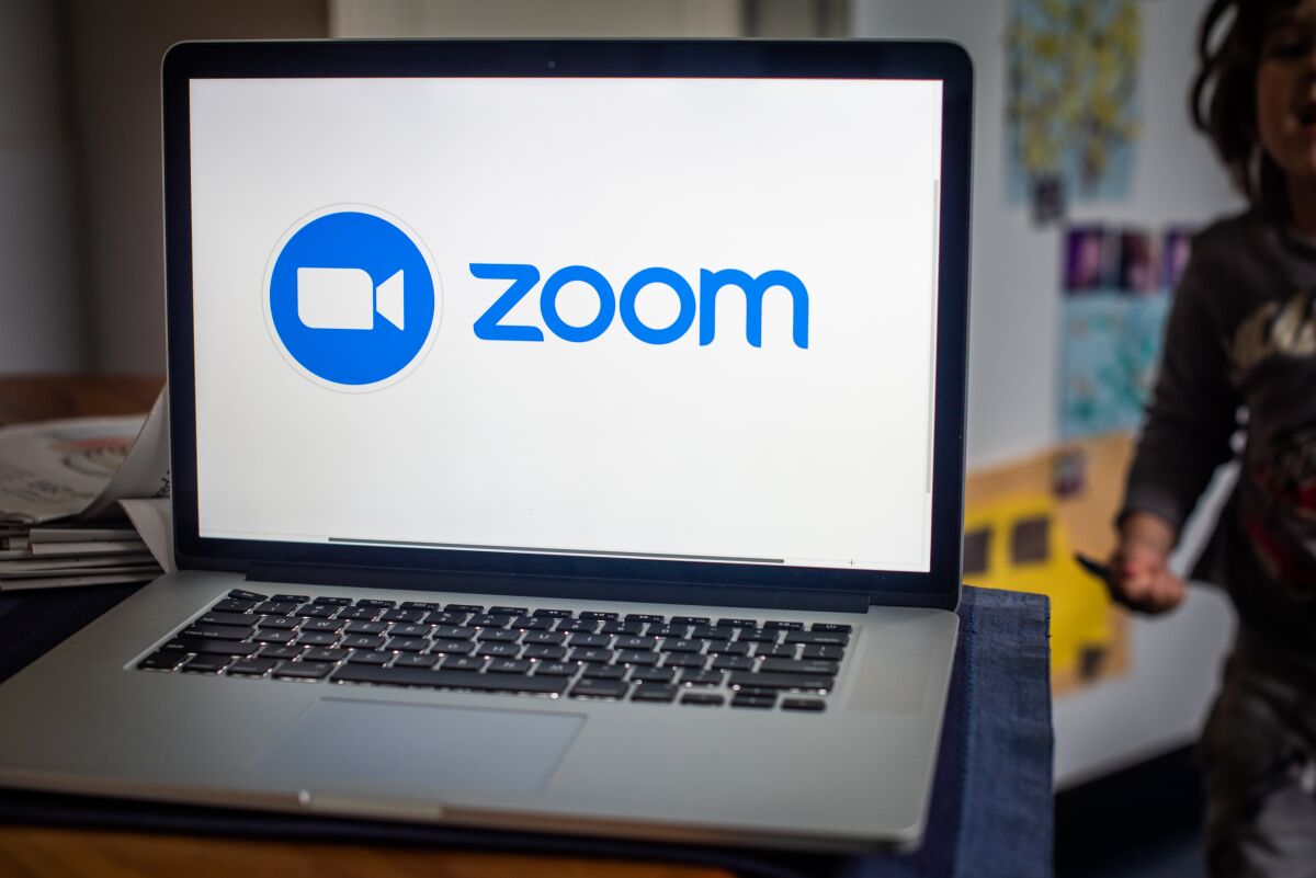 The Zoom name and logo on a laptop