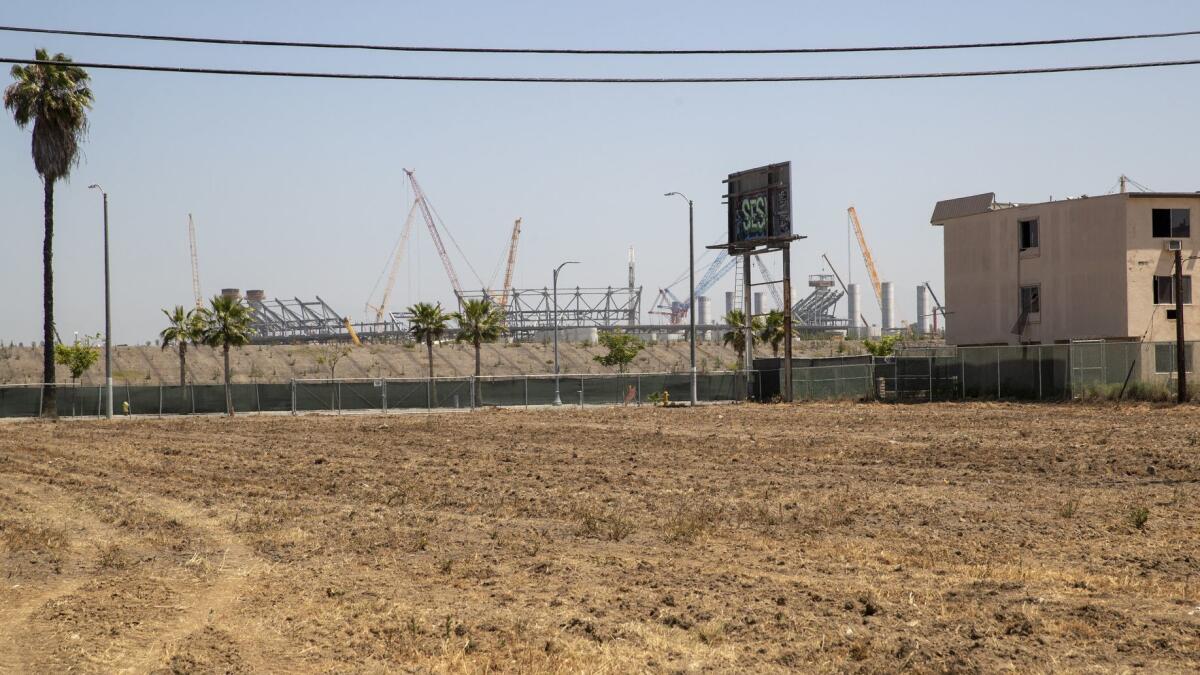 A view of the vacant site of the proposed Clippers arena project in Inglewood in June when construction of the football stadium had started.