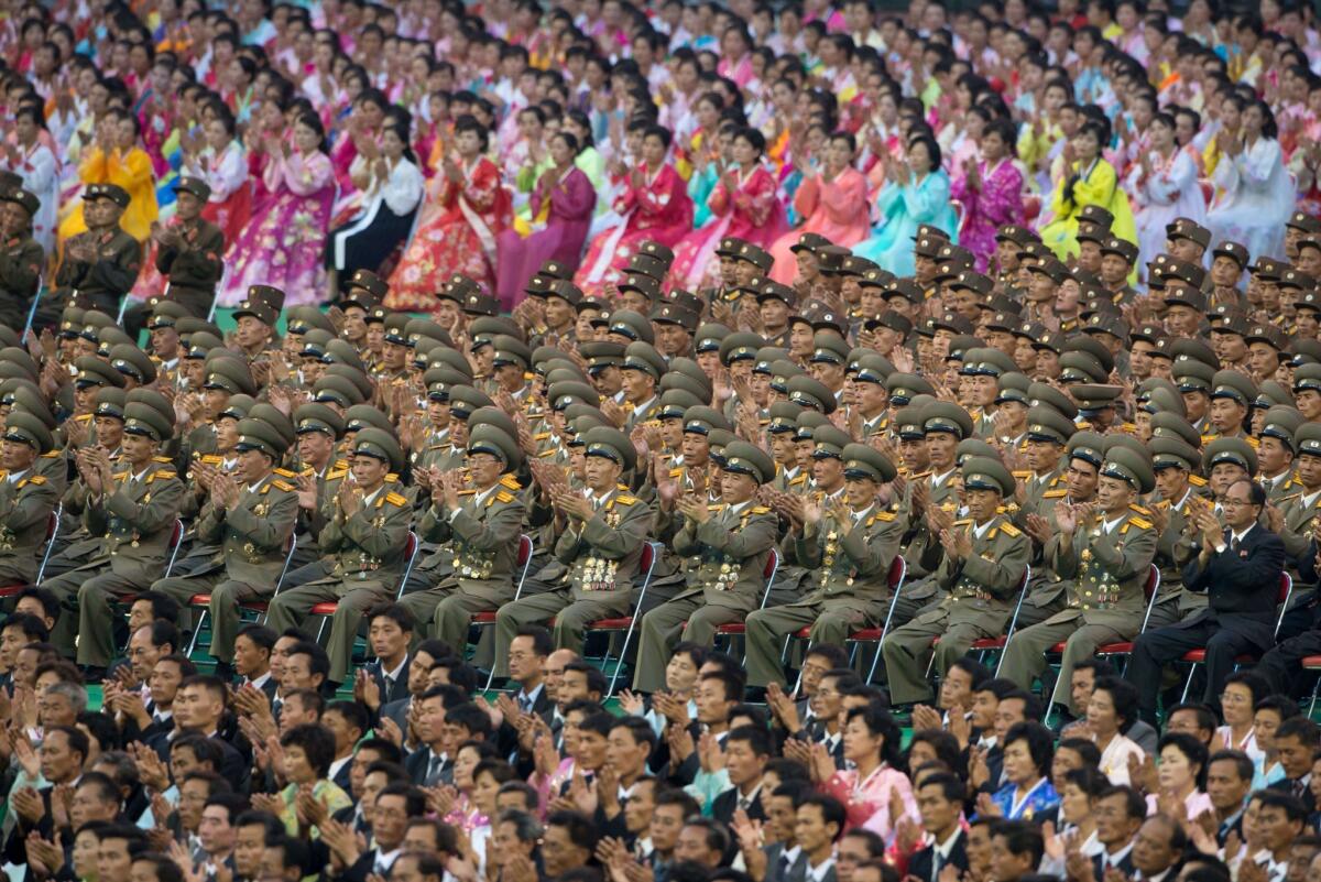 Spectators applaud an appearance by North Korean leader Kim Jong Un on the eve of the 60th anniversary of the cease-fire that halted, but has yet to formally end, the 1950-53 Korean War. The display of dance, acrobatics and gymnastics featured 100,000 participants at the 150,000-seat Rungnado May Day Stadium in Pyongyang.