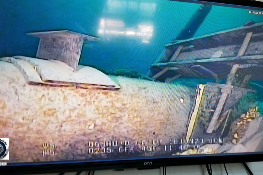 FILE - In this photo provided by the Michigan Department of Environment, Great Lakes, and Energy, footage played on a television screen shows damage to anchor support EP-17-1 on the east leg of the Enbridge Line 5 pipeline within the Straits of Mackinac, Mich., in June 2020. A federal review of plans for the Great Lakes oil pipeline tunnel will take more than a year longer than originally planned, officials said Thursday, March 23, 2023, likely delaying completion of the project — if approved — until 2030 or later. (Michigan Department of Environment, Great Lakes, and Energy via AP, File)