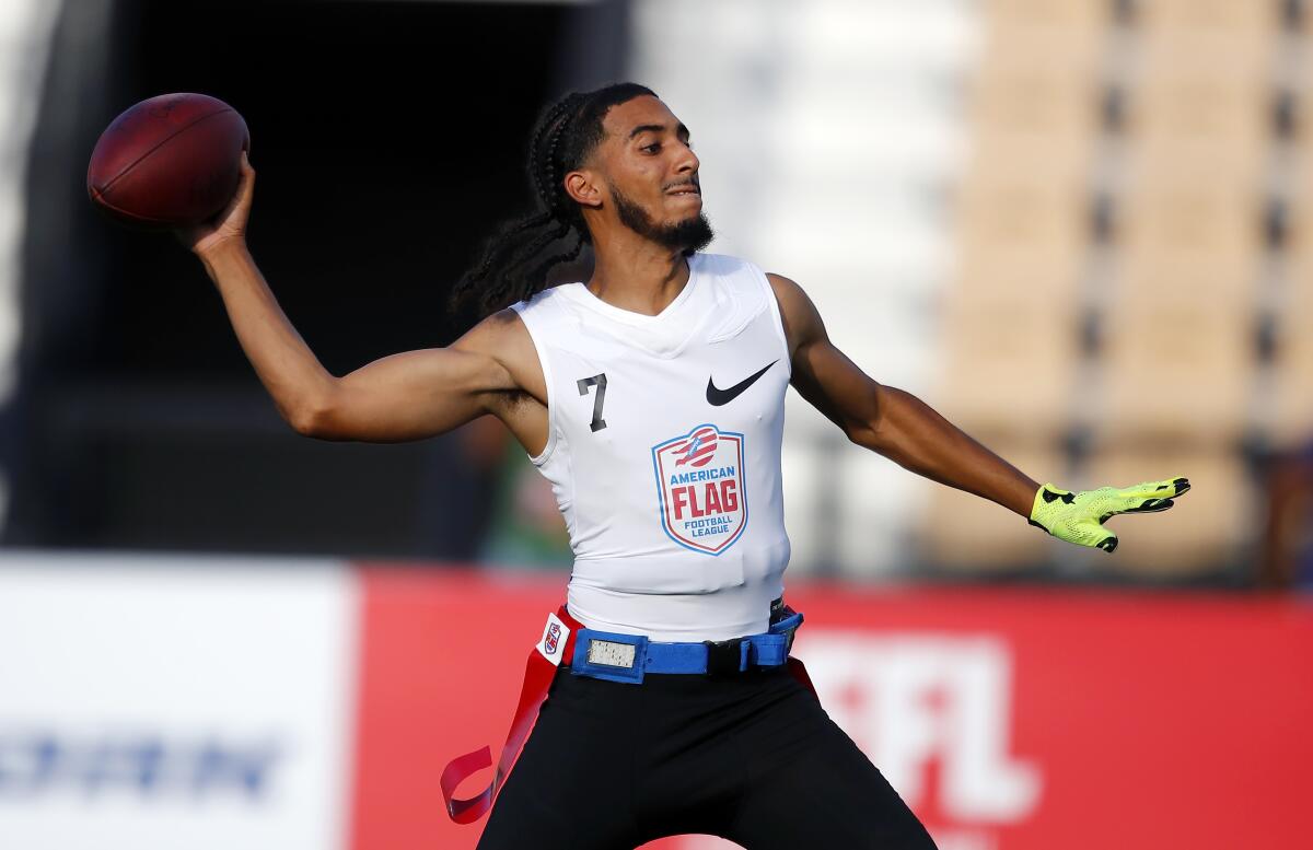 Fighting Cancer's Darrell Doucette passes during a semifinal round game at the AFFL U.S. Open of Football tournament