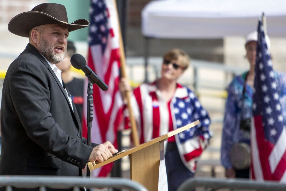 FILE - Far-right activist Ammon Bundy speaks to a crowd of about 50 followers in front of the Ada County Courthouse in downtown Boise, Idaho, April 3, 2021. Bundy, who's running for governor in Idaho, has been arrested after refusing to leave a hospital in connection with a child-welfare case, police said Saturday, March 12, 2022. Bundy was arrested at about 1:15 a.m. on suspicion of misdemeanor trespassing at St. Luke's Meridian Medical Center in Meridian, west of Boise, the Idaho Statesman reported. (Darin Oswald/Idaho Statesman via AP, File)