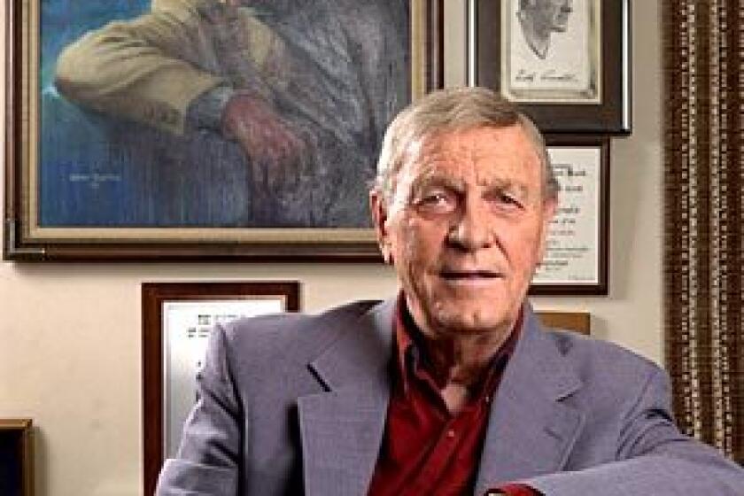 Country music legend Eddy Arnold in his memorabilia-filled office in Brentwood, Tenn., in 2002. Arnold died at a care facility near Nashville. He was 89.