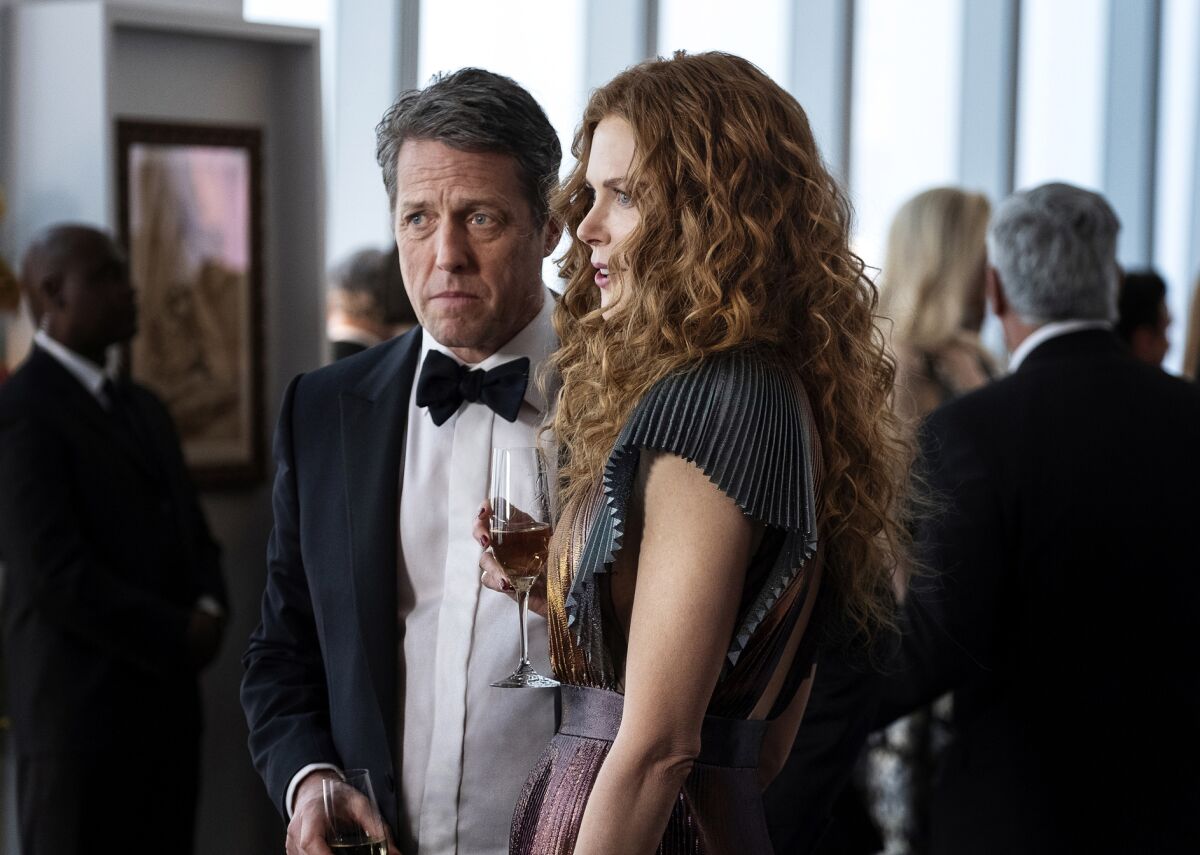 This image released by HBO shows Hugh Grant, left, and Nicole Kidman in a scene from "The Undoing." The Nielsen company said some three million people watched on Sunday to learn the mystery's resolution in the limited series. (HBO via AP)