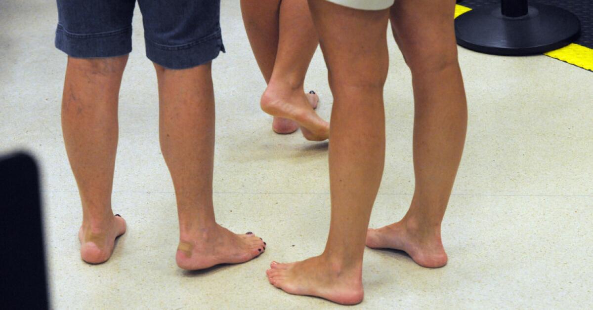 Barefoot passengers wait to retrieve their shoes while going through the TSA checkpoint at Hartsfield¿Jackson Atlanta International Airport in 2011.