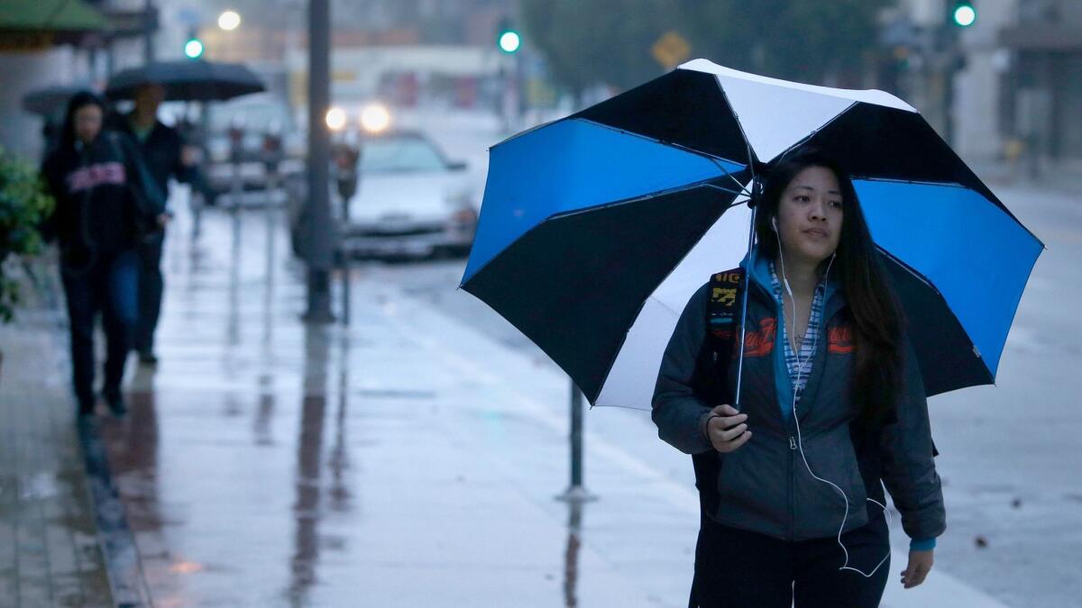 Light rain falls across Southern California on Thursday with more expected in the coming days.