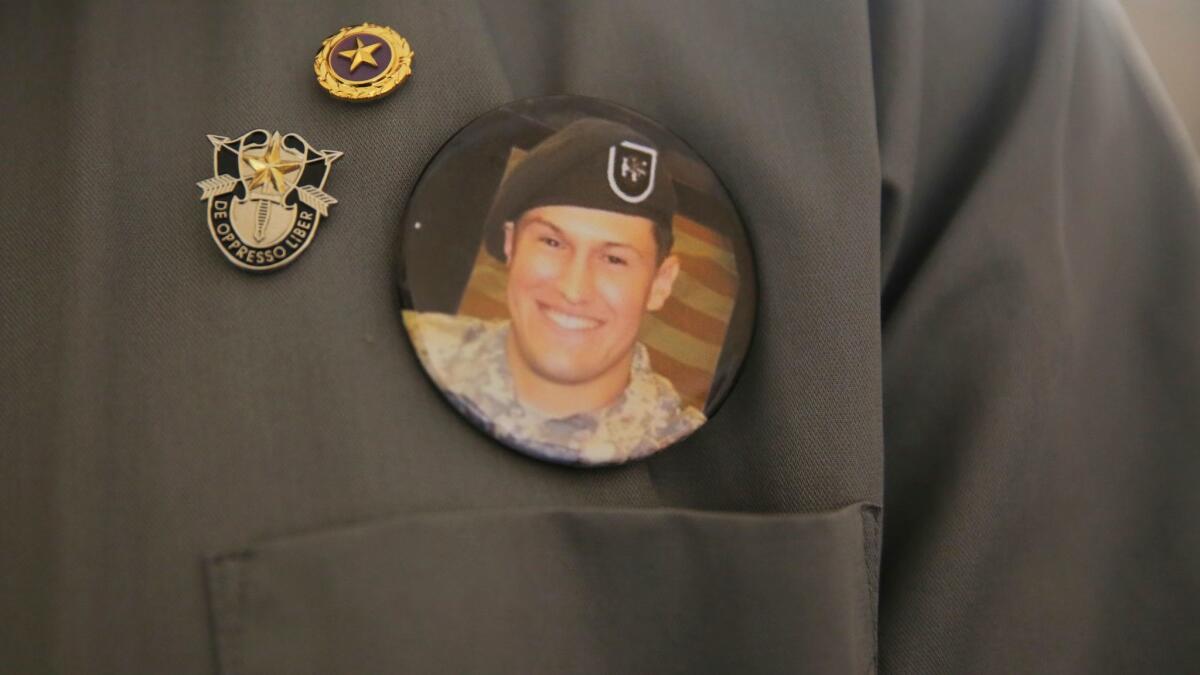 A pin bearing the image of Staff Sgt. Matthew C. Lewellen, a slain Green Beret, is worn by his father, Charles, in Amman, Jordan, on July 17, 2017.