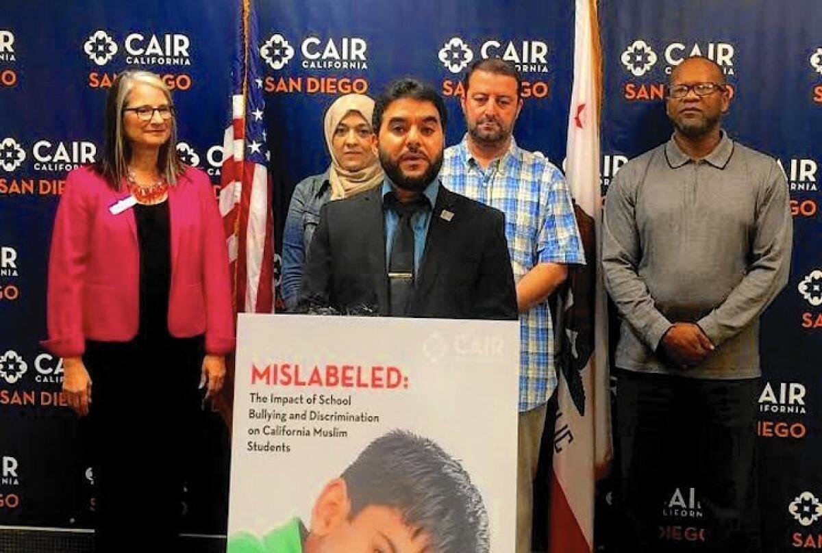 Hanif Mohebi, executive director of the San Diego office of the Council on American-Islamic Relations, speaks at a news conference Friday about the bullying of Muslim students in schools.