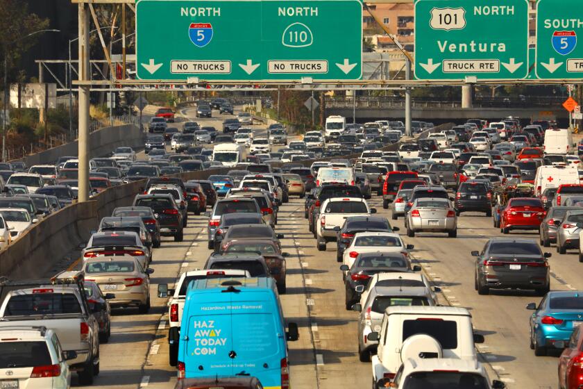 Los Angeles, California-June 15, 2021-Traffic has returned to Los Angeles. Rush hour at the intersection of the 110 and 101 freeways on June 15, 2021. (Carolyn Cole / Los Angeles Times)