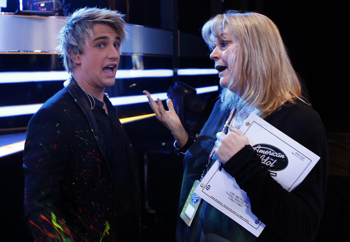 Contestant Dalton Rapattoni chats with executive producer Trish Kinane during a dress rehearsal for "American Idol" in Hollywood.