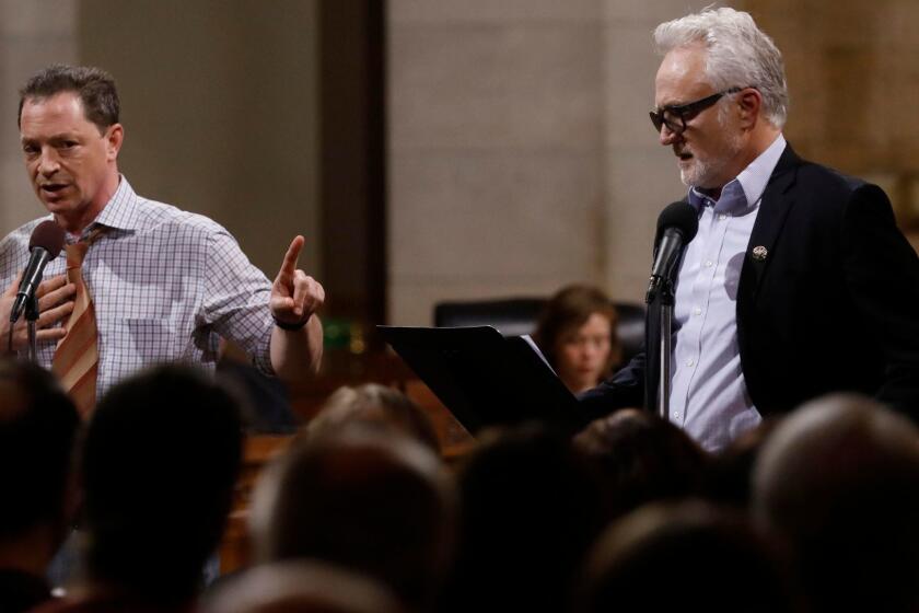 LOS ANGELES, CA - JANAUARY 27, 2018 - Actors Joshua Malina, left, as Carl Bernstein, and Bradley Whitford, as Bob Woodward, perform in The Fountain Theatre's production of a one-night-only reading of the screenplay to "All the President's Men," in City Council Chambers in City Hall in Los Angeles on January 27, 2018. (Genaro Molina / Los Angeles Times)
