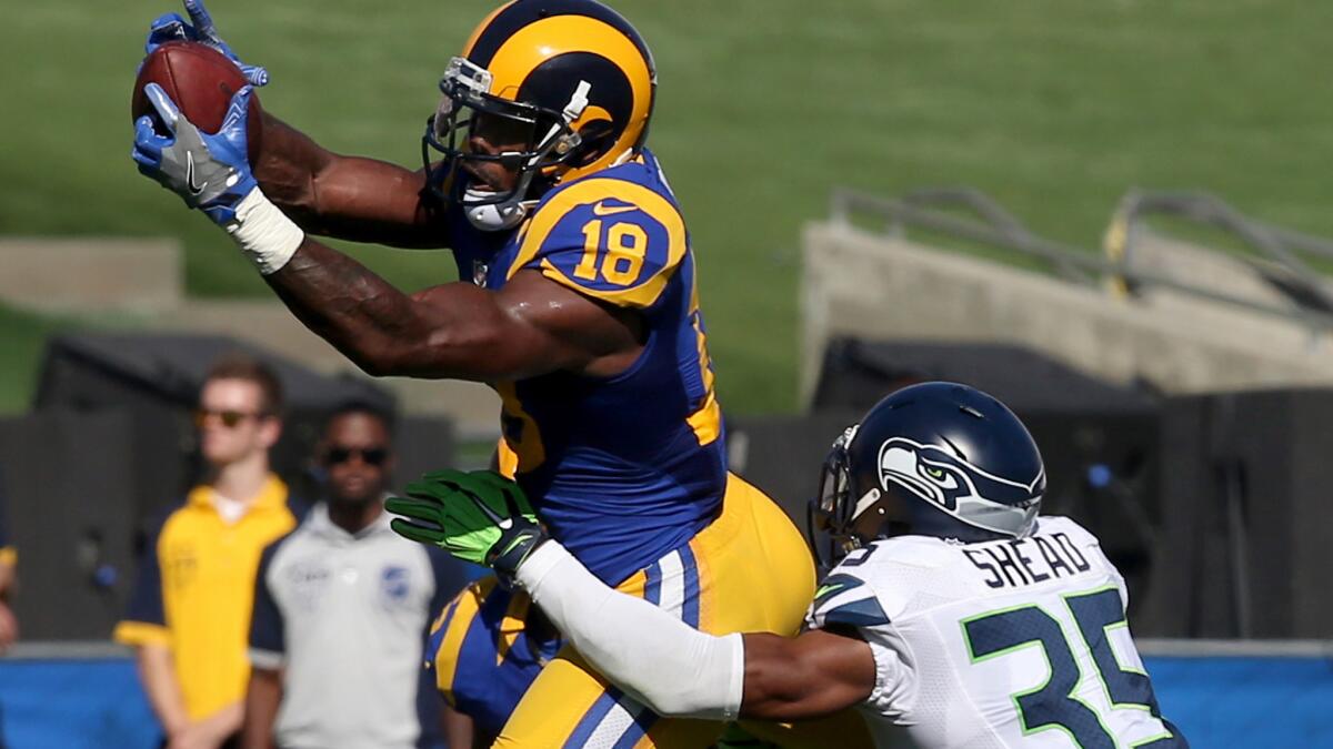 Rams wide receiver Kenny Britt makes a catch against Seahawks defensive back DeShawn Shead during the fourth quarter Sunday.