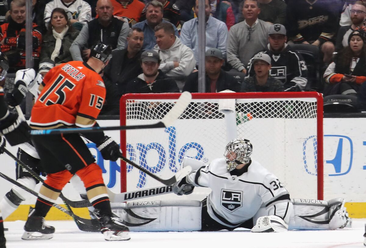 Kings goalie Jonathan Quick (32) defends the net against Ducks' Ryan Getzlaf (15) during the second period at the Honda Center on Thursday.