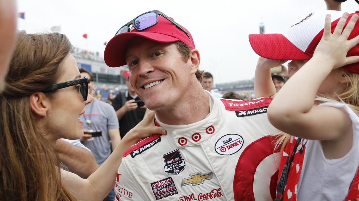 Scott Dixon celebrates with his wife, Emma, and daugher Tilly after capturing pole position Sunday for this weekend's Indianapolis 500.