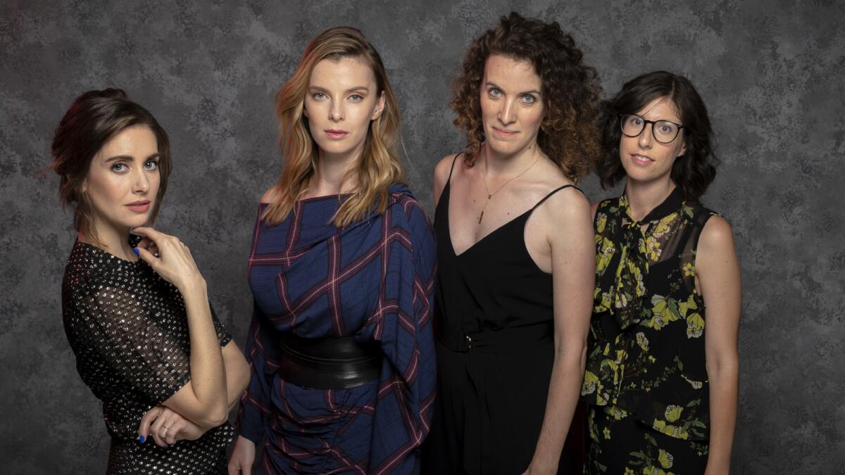 Netflix original series "Glow" stars Alison Brie and Betty Gilpin, and show creators Liz Flahive and Carly Mensch.