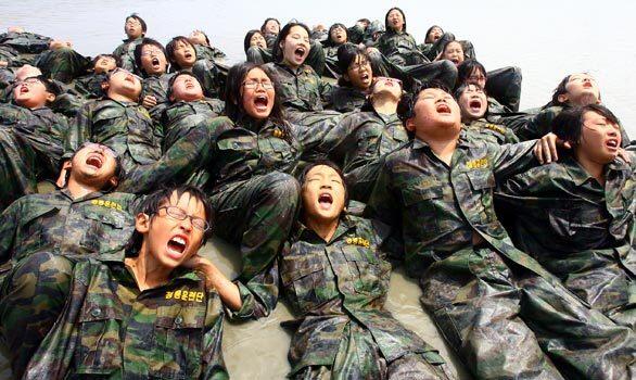 South Korean teenagers are put through their paces amid rain and mud at the Blue Dragon Marine Corps Training Camp near Seoul. Many parents think their children are coddled and need to be toughened up.