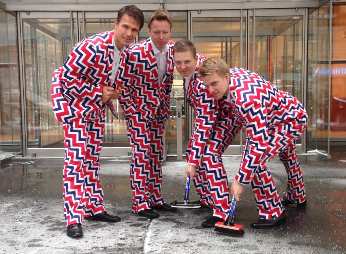 Members of the Norwegian men's Olympic curling team -- from left Thomas Ulsrud, Torgor Nergard, Christoffer Svae and Havard Vad Petersson -- model their new Sochi 2014 suits.