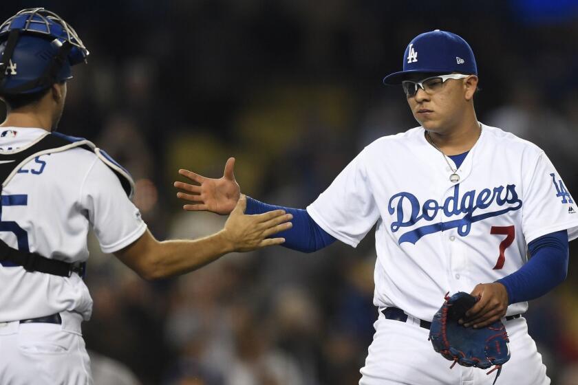 LOS ANGELES, CA - MAY 06: Pitcher Julio Urias #7 of the Los Angeles Dodgers celebrates with catcher Austin Barnes #15 after defeating the Atlanta Braves, 5-3, at Dodger Stadium on May 6, 2019 in Los Angeles, California. (Photo by Kevork Djansezian/Getty Images) ** OUTS - ELSENT, FPG, CM - OUTS * NM, PH, VA if sourced by CT, LA or MoD **