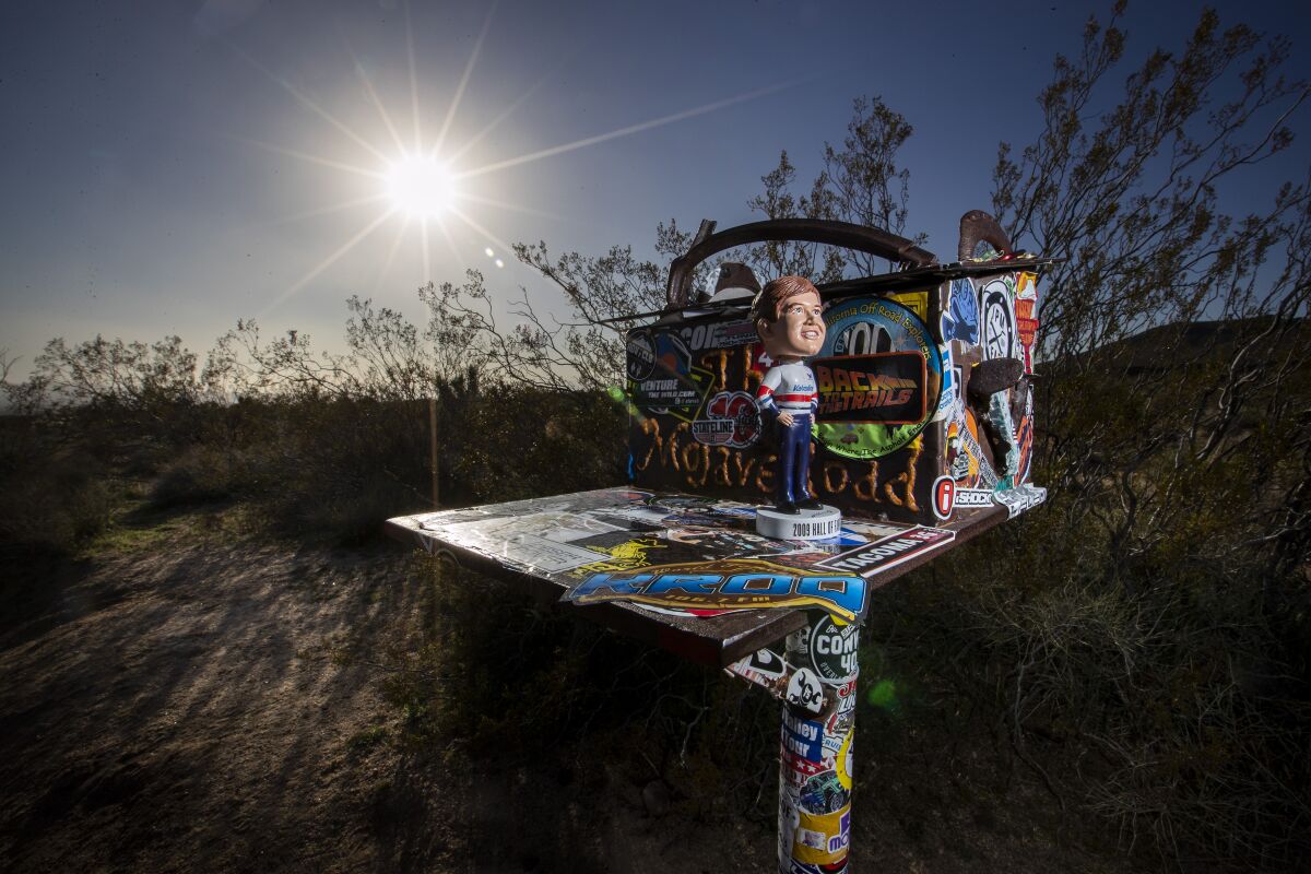 An Al Unser Jr. bobblehead sits on the Mojave Mailbox along the historic Mojave Road.