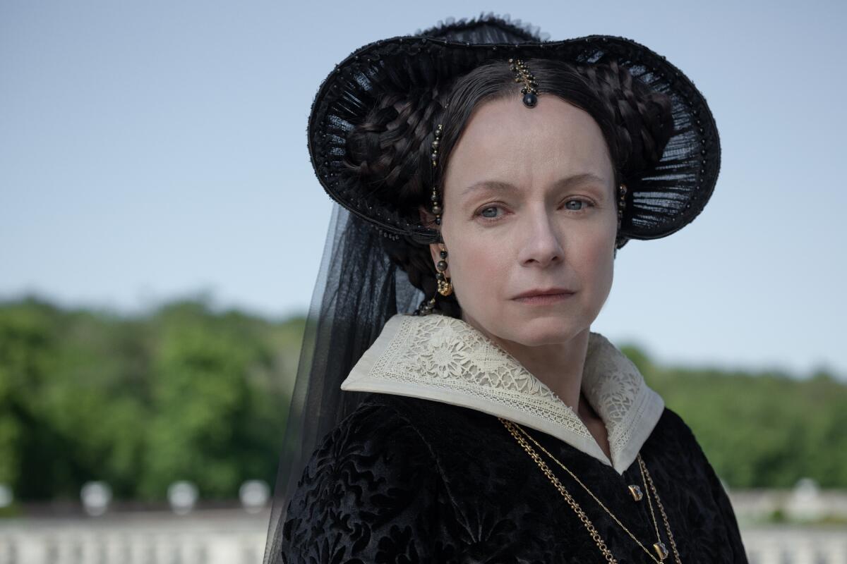 A Renaissance queen in an elaborate black hat 