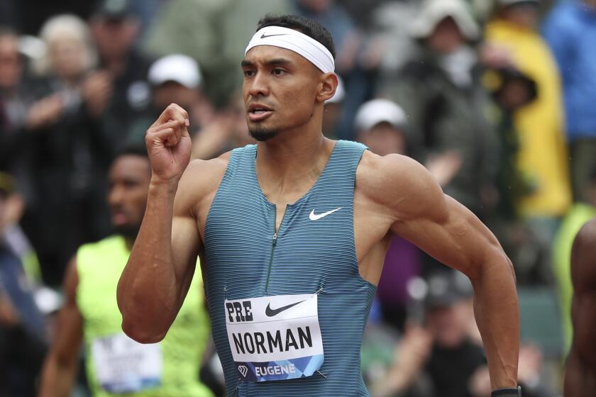 United States' Michael Norman, center, runs in the men's 400 meters during the Prefontaine Classic.