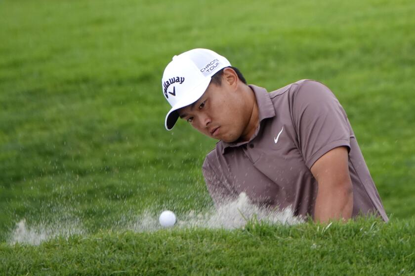 San Diego CA - January 24: Kevin Yu hits out of the sand on the final hole of his first round of the Farmers Insurance Open at Torrey Pines on Wednesday, January 24, 2024 in San Diego, CA. (K.C. Alfred / The San Diego Union-Tribune)