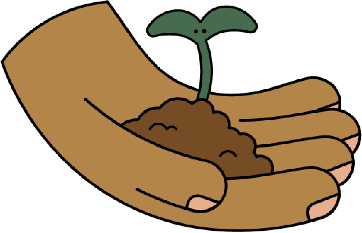 Hand holding a sprout growing from dirt.