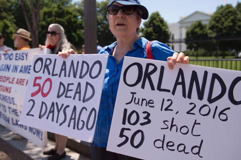 People protest gun violence and call for sensible gun laws outside the White House on June 13.