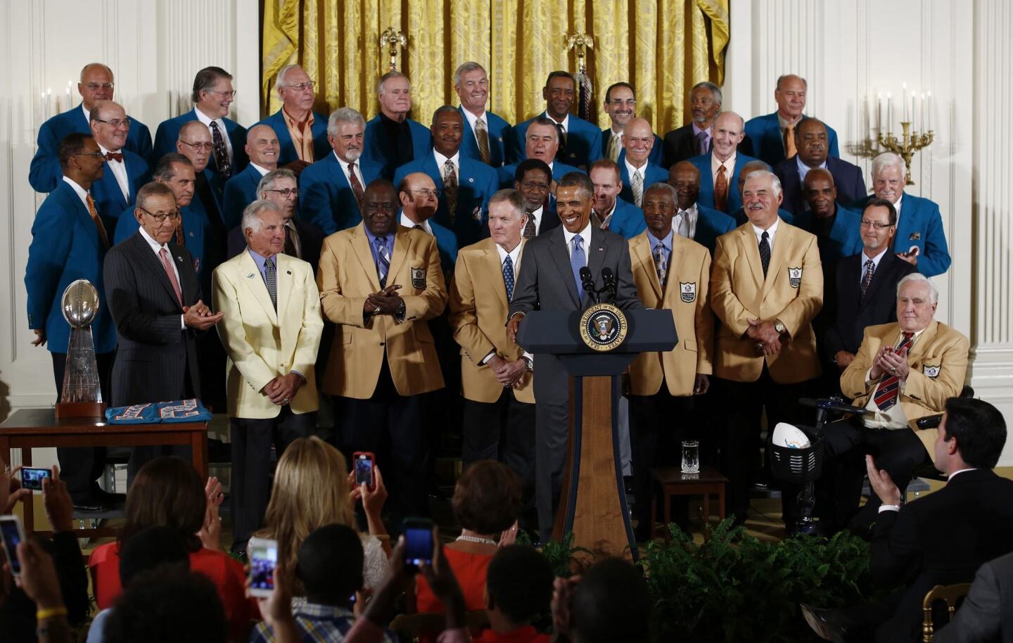 U.S. President Obama honors the 1972 season NFL Super Bowl winning football team, the Miami Dolphins in the East Room of the White House in Washington,