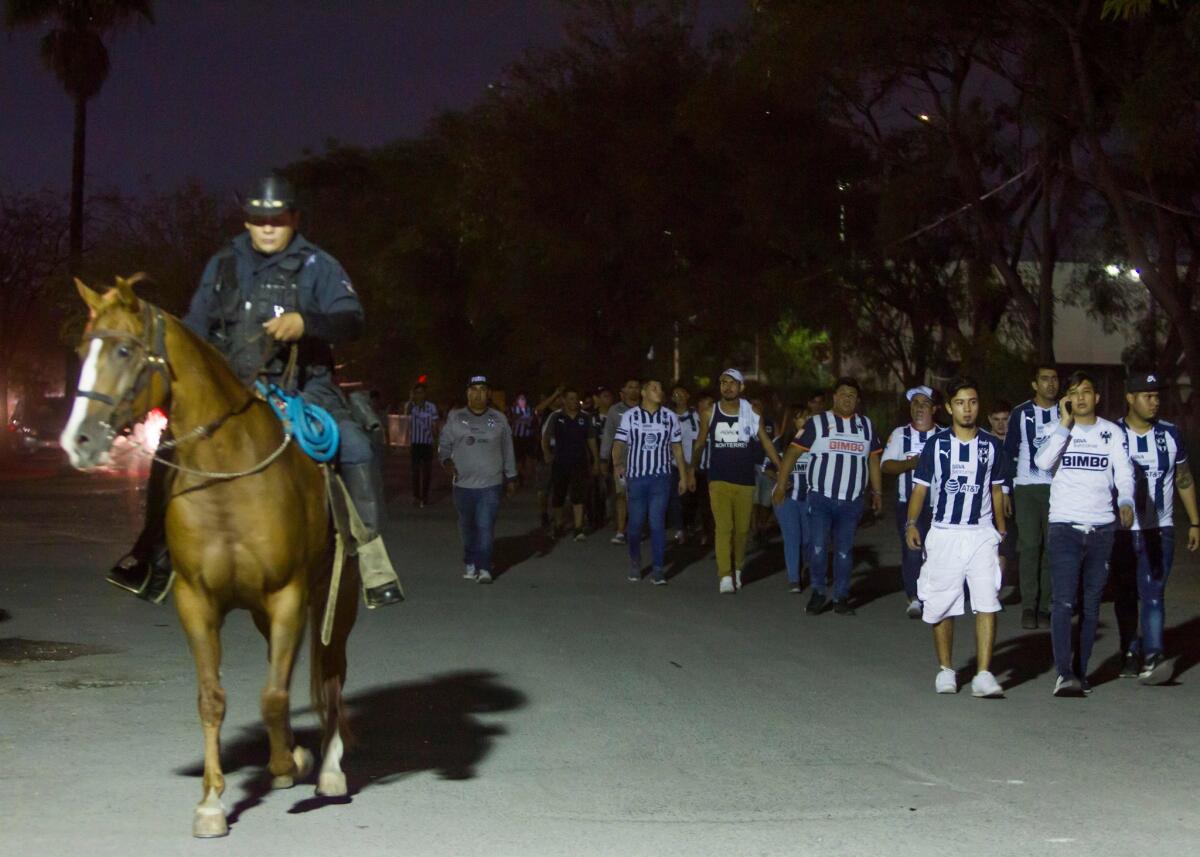 State Police guard Monterrey's fans outside the University stadium as they look for the responsible of attacking a Tigres' fan in Monterrey, Mexico, on September 23, 2018.