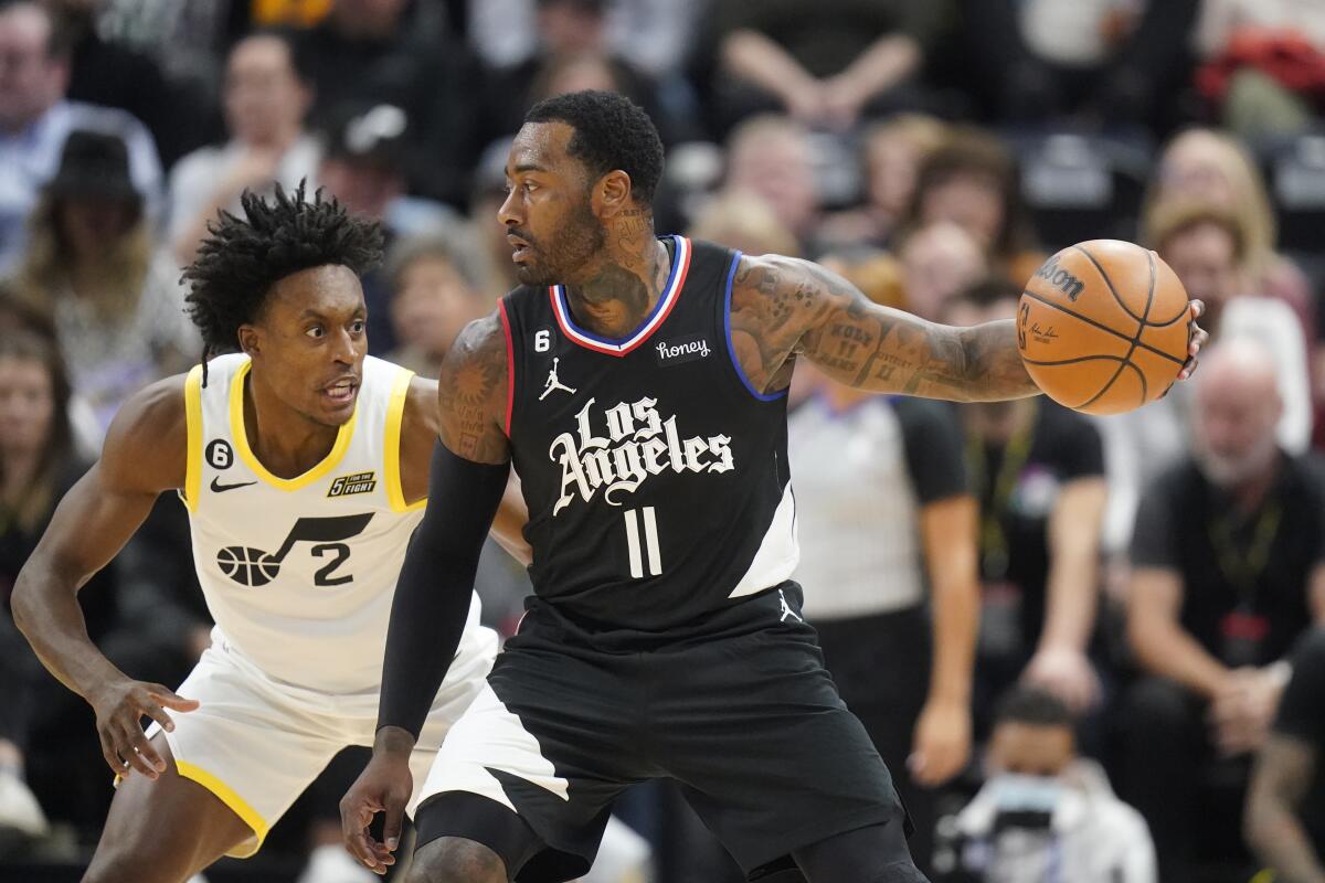 Utah Jazz guard Collin Sexton defends Clippers guard John Wall.