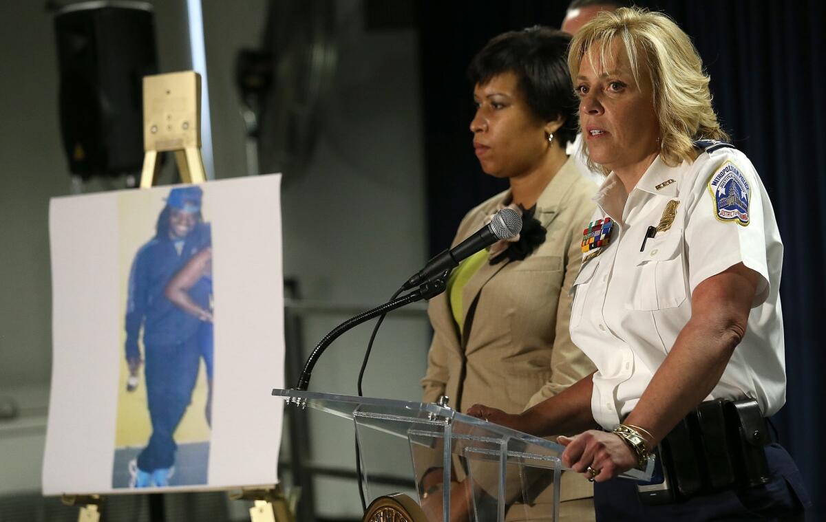 Chief of the Metropolitan Police Department Cathy Lanier, right, discusses the search for slaying suspect Daron Dylon Wint at a May 21 news conference at police headquarters in Washington.