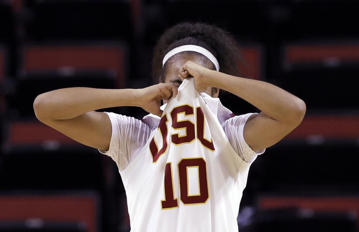 USC guard Courtney Jaco pulls her jersey over her face in the final moments of the Women of Troy's 75-63 loss to Colorado in the Pac-12 Tournament.