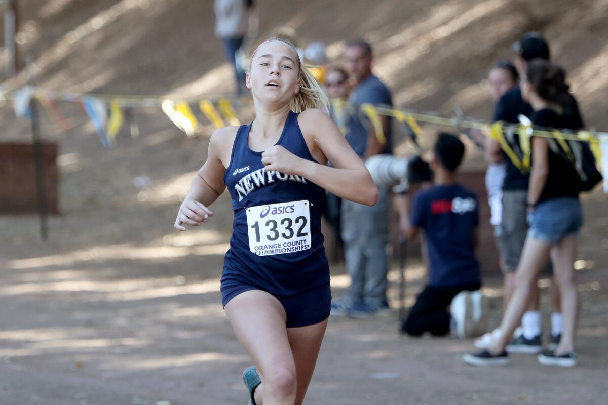 Newport Harbor sophomore Emma Scheumann approaches the finish line in the Orange County cross-country championships.