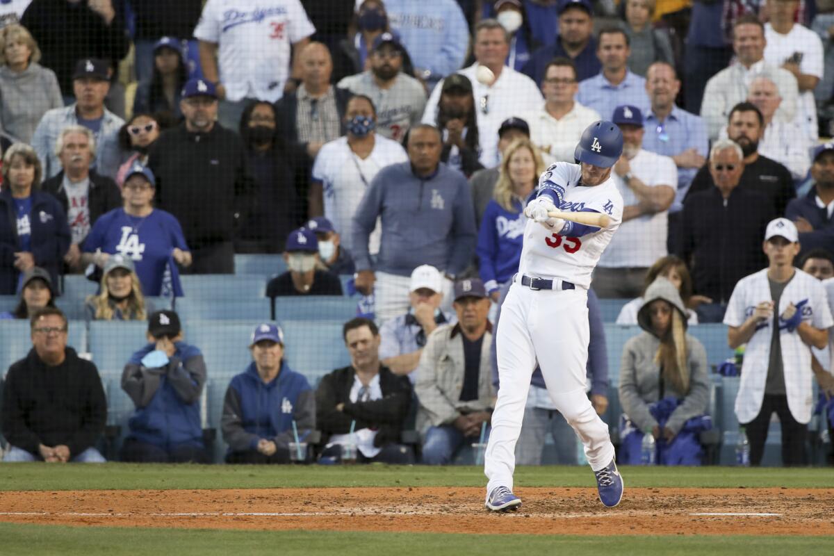 Cody Bellinger hits a game-tying, three-run home run during the eighth inning.