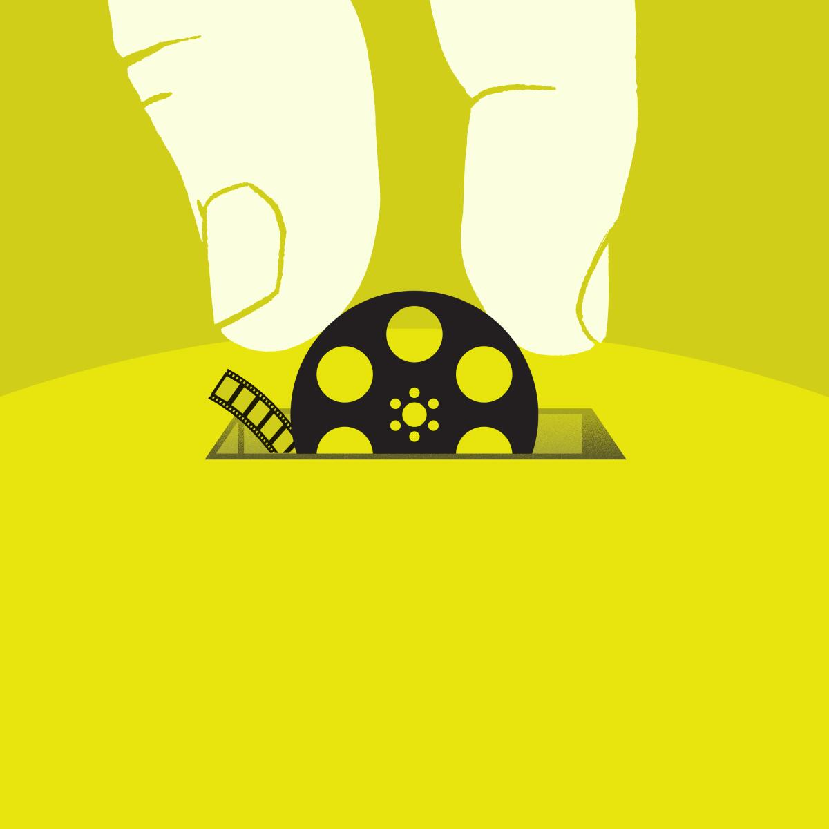 Illustration of fingers inserting a film reel into a coin slot.