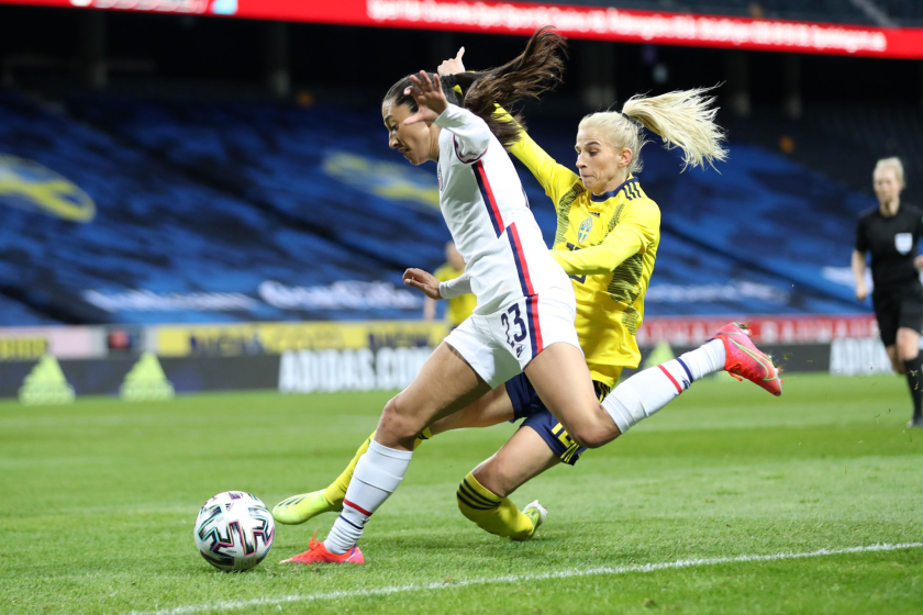 Christen Press of United States is challenged by Sofia Jakobson of Sweden.