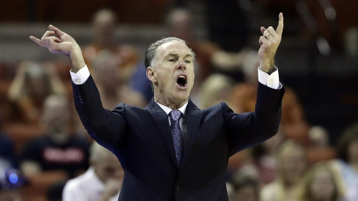 TCU head coach Jamie Dixon directs his players during the first half against Texas on March 9 in Austin.