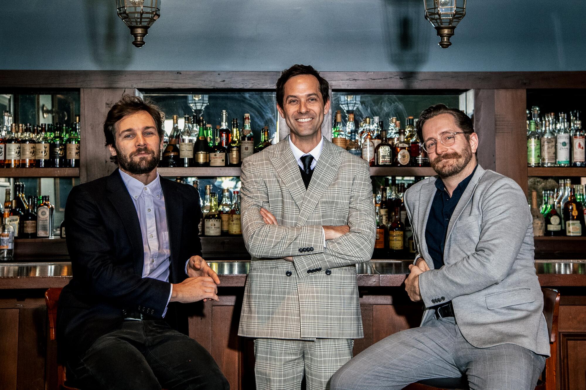 Three men at Manzke's bar.