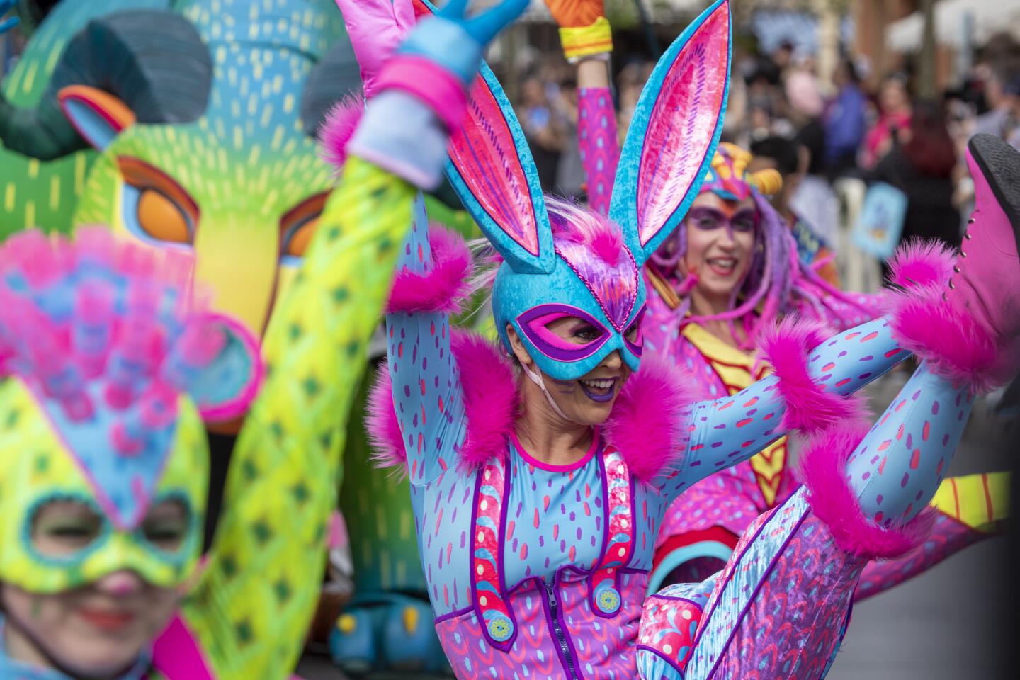 ANAHEIM, CALIF. -- THURSDAY, FEBRUARY 27, 2020: Dancers in vibrant, elaborate costumes lead Disney's "Frozen II" float in the new daytime parade titled "Magic Happens" of more than 90 dancers on Main Street U.S.A. on Thursday, Feb. 27, 2020 in Anaheim. Disneyland gave the media and Disneyland guests a sneak peak of the parade that will begin running for the general public Friday, Feb. 28. (Allen J. Schaben / Los Angeles Times)