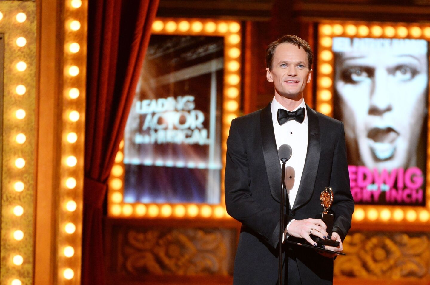 Neil Patrick Harris accepts the award for best performance by an actor in a leading role in a musical for "Hedwig and the Angry Inch."