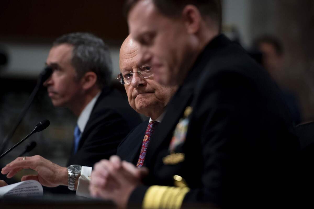 Defense Undersecretary for Intelligence Marcell Lettre, from left, Director of National Intelligence James R. Clapper and National Security Agency Director Adm. Michael Rogers testify before the Senate Armed Services Committee.